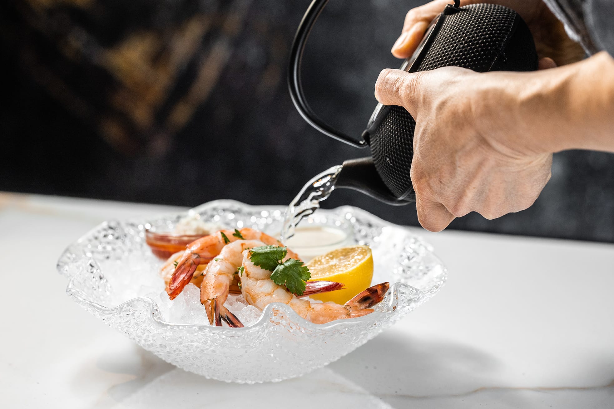 chef preparing grilled shrimp cocktail appetizer